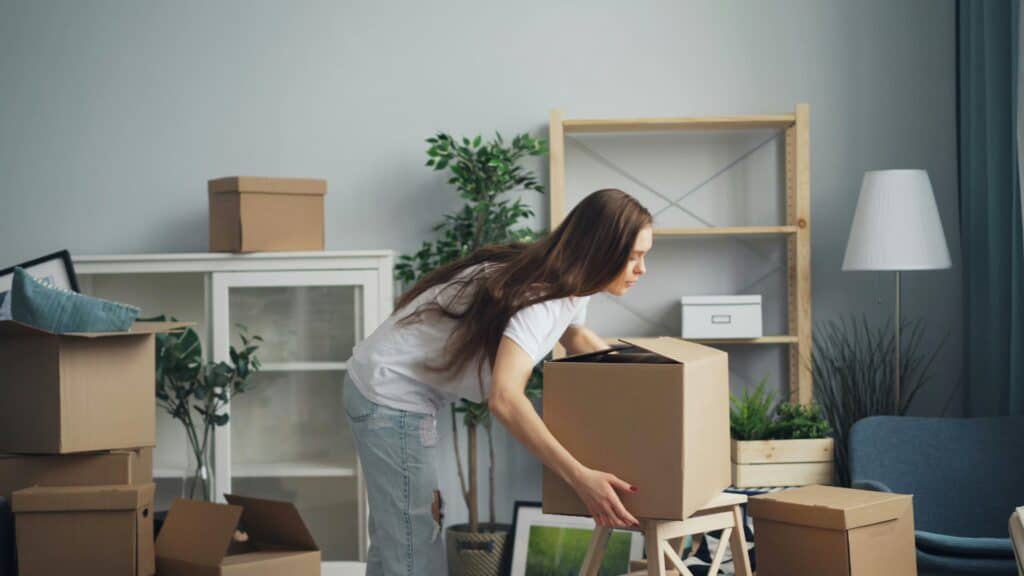 teen moving a box