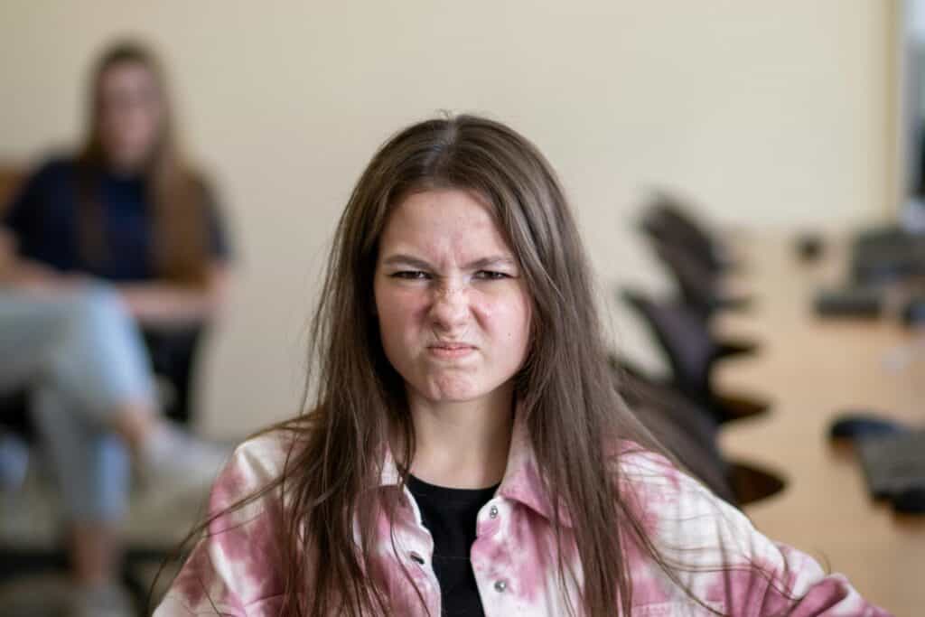 teen girl frown scowl angry