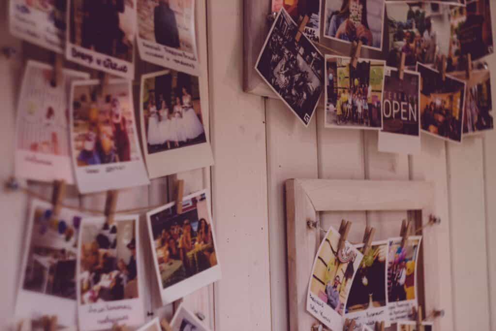 old photos hung on wall polaroid past
