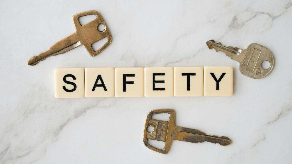 tiles spelling out safety keys on marble background