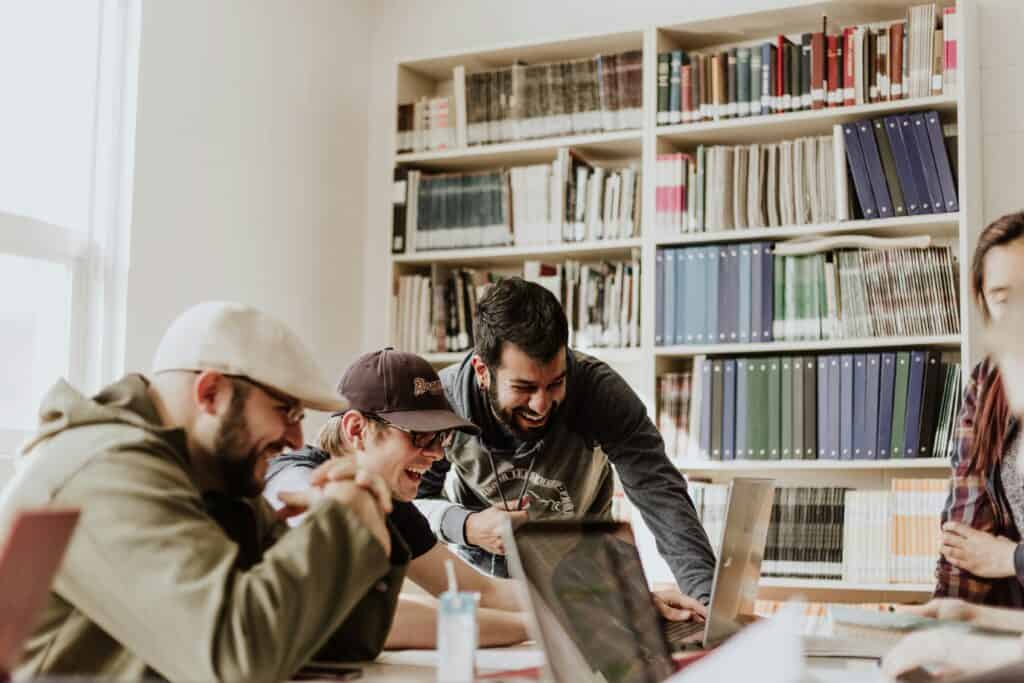 guys laughing looking at computer