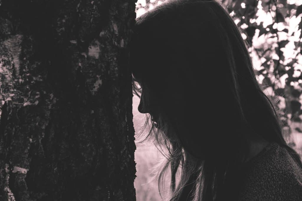 dark image of discouraged woman