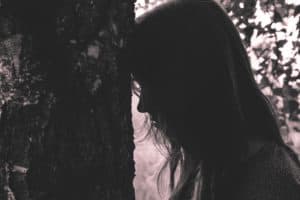 dark image of discouraged woman