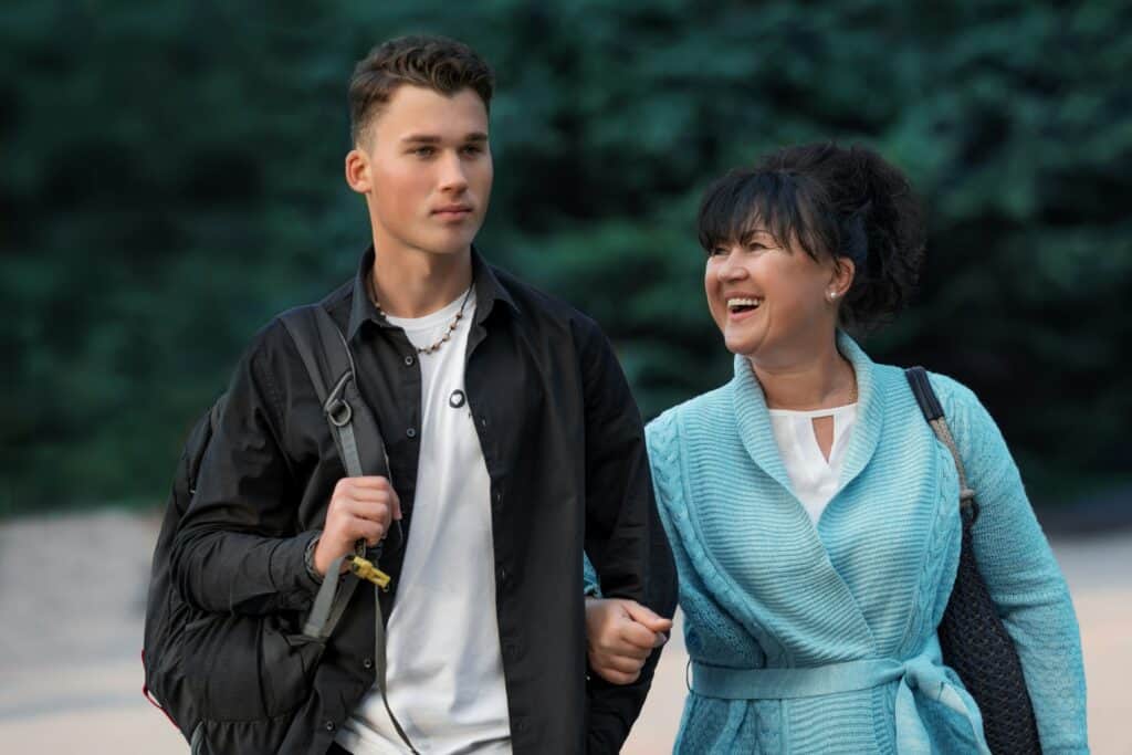 mom and teen son walking