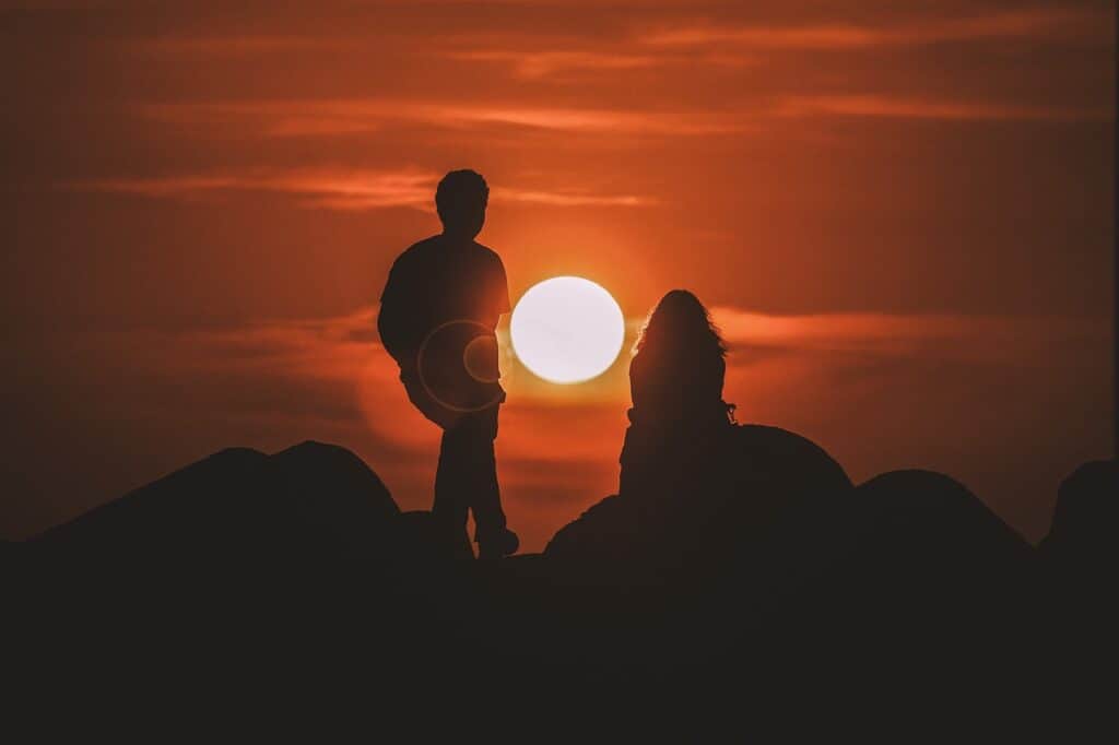 shadows against sunset of man and woman