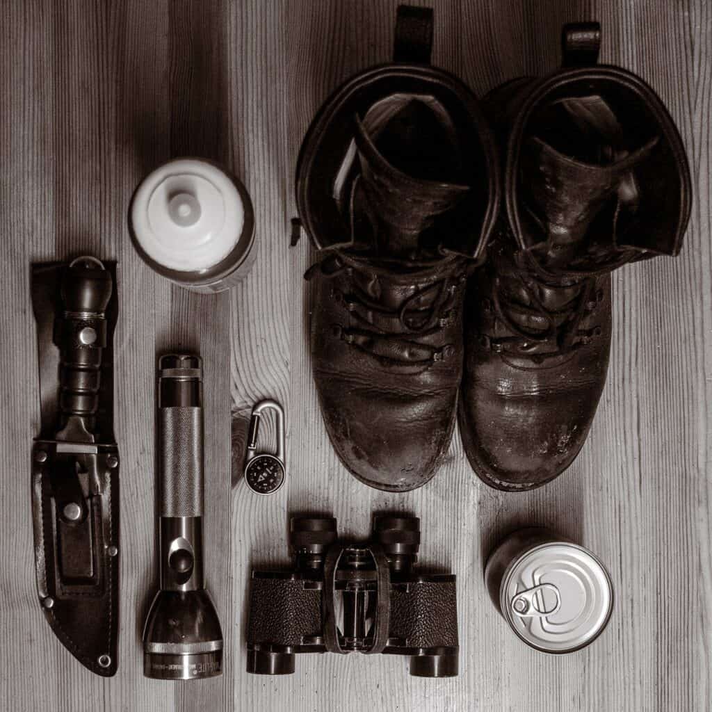 knife flashlight binoculars compass canned food boots