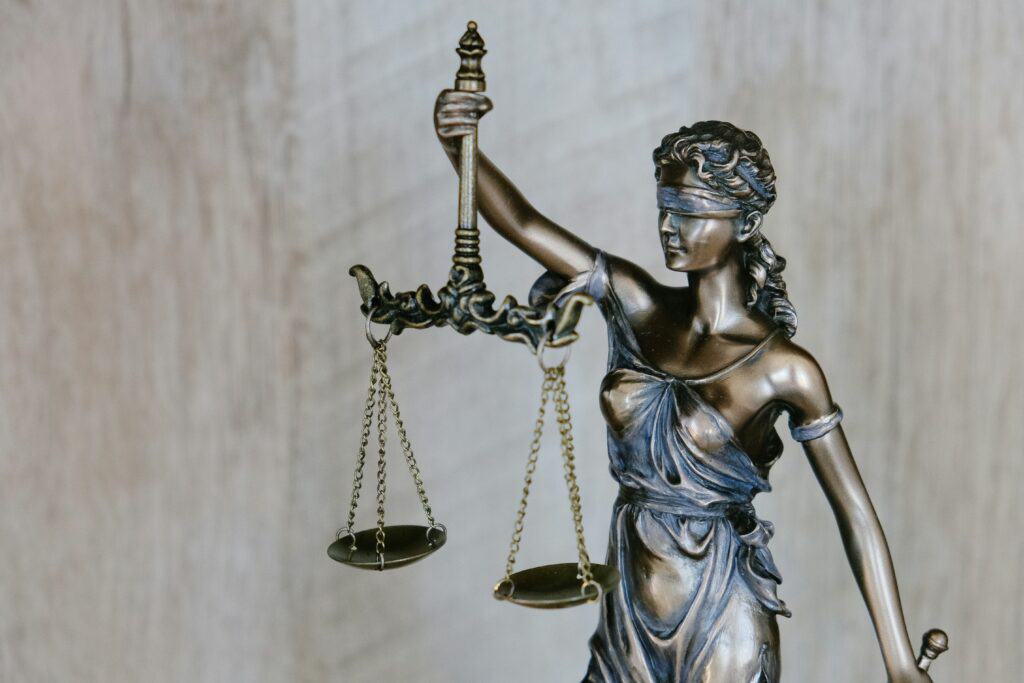 lady justice holding scales statue figurine