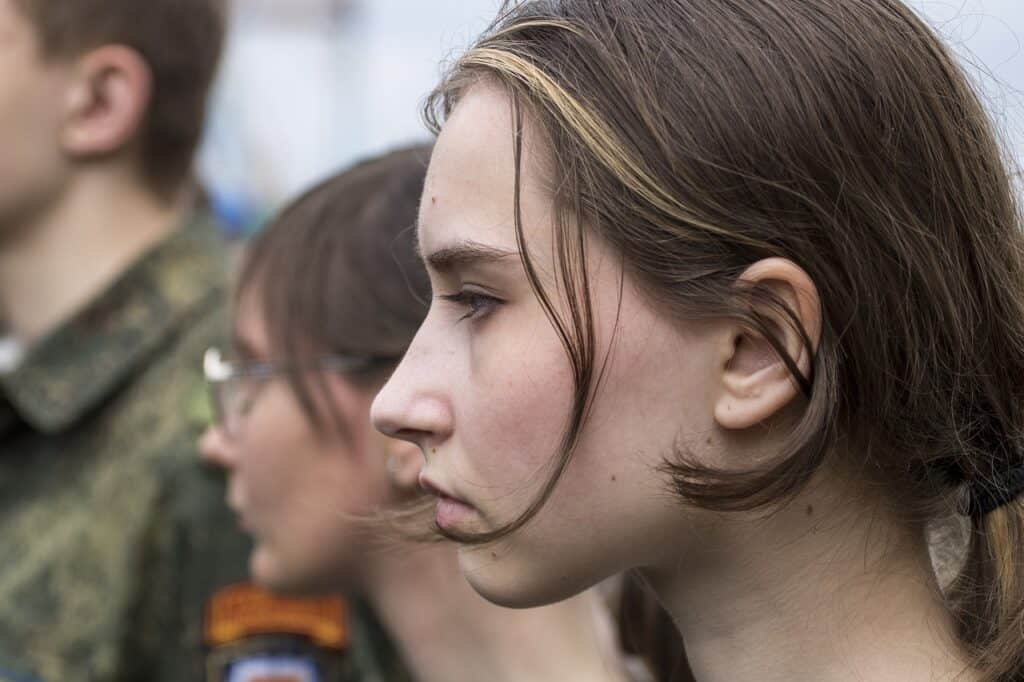 sullen looking teen girl