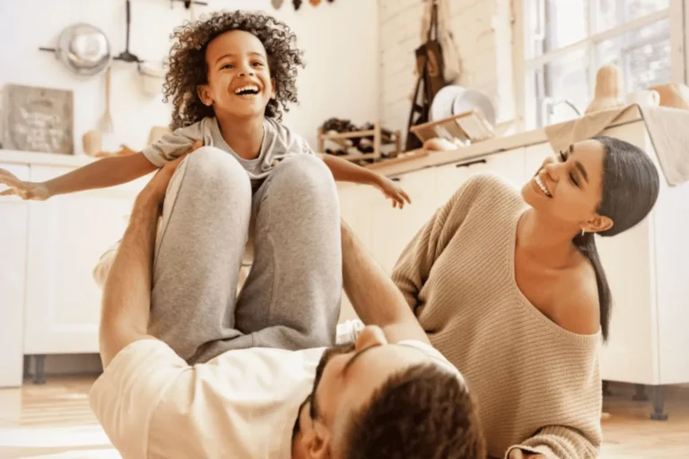 Parents playing on the floor with young child