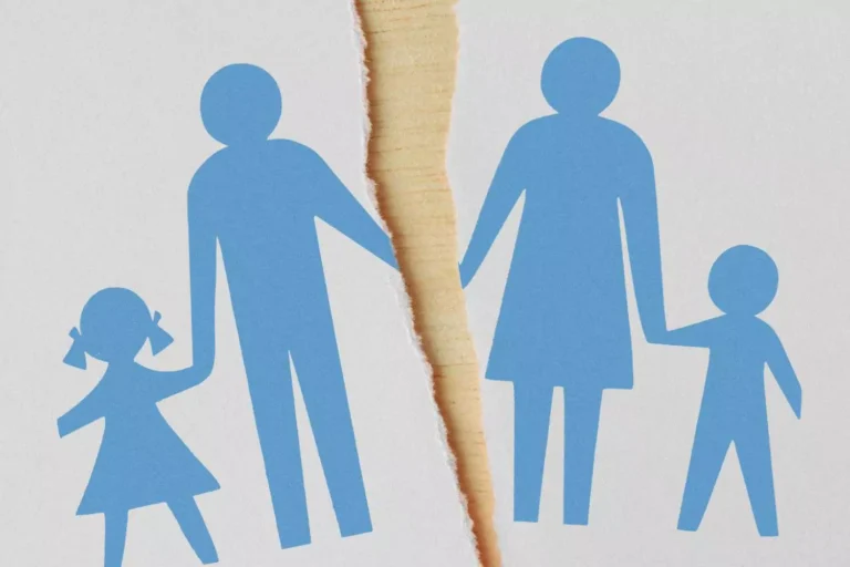 A torn paper cutout of a family symbolizing separation, illustrating the challenges of jealousy in blended families.