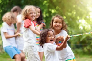 five little girls playing tug of war