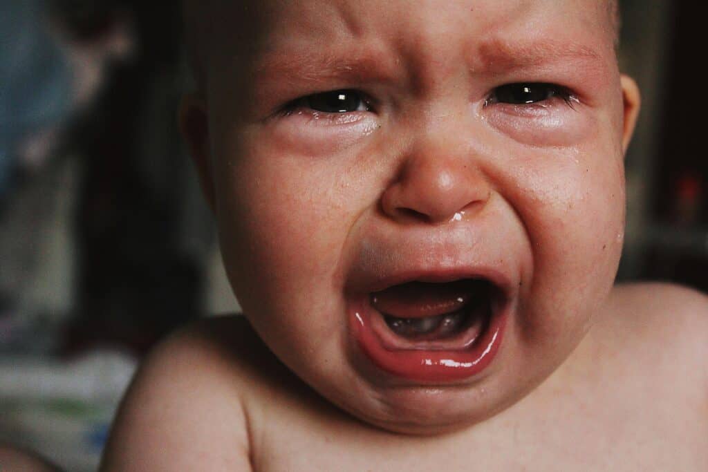 face of crying baby angry