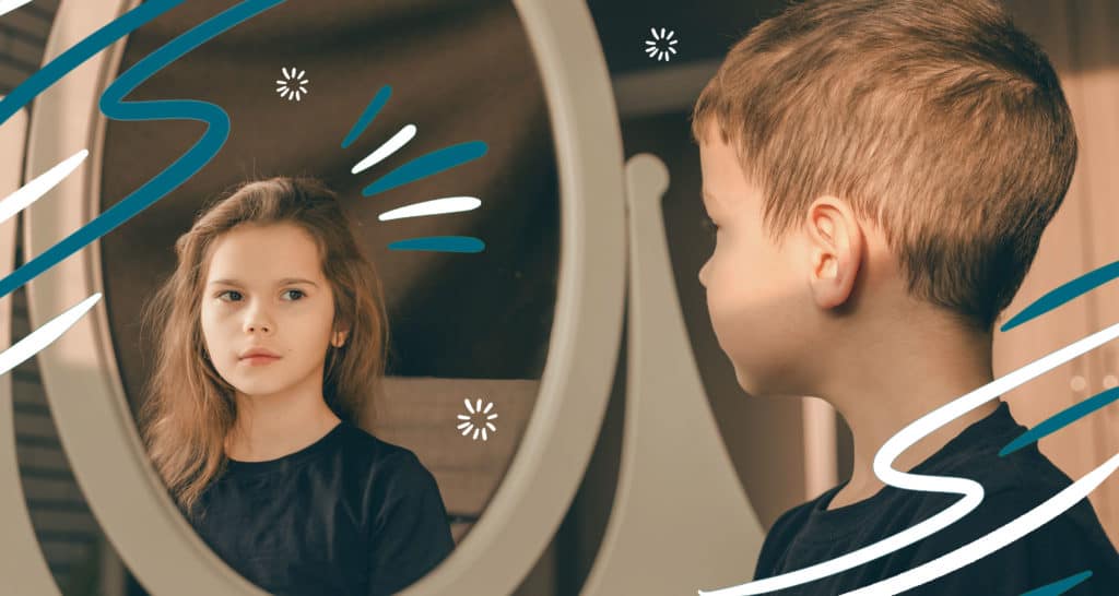 Transgender boy looking at reflection in mirror and seeing a girl