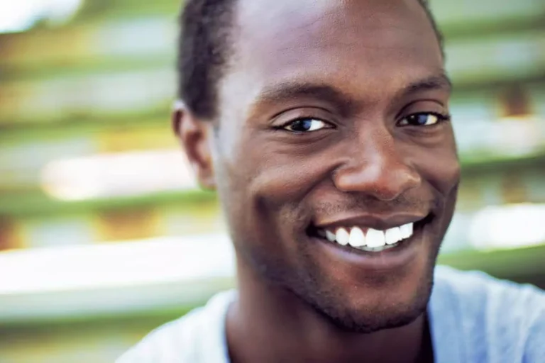 A kingdom man submits his life to Jesus — a joyful man smiling confidently, reflecting inner peace and faith.