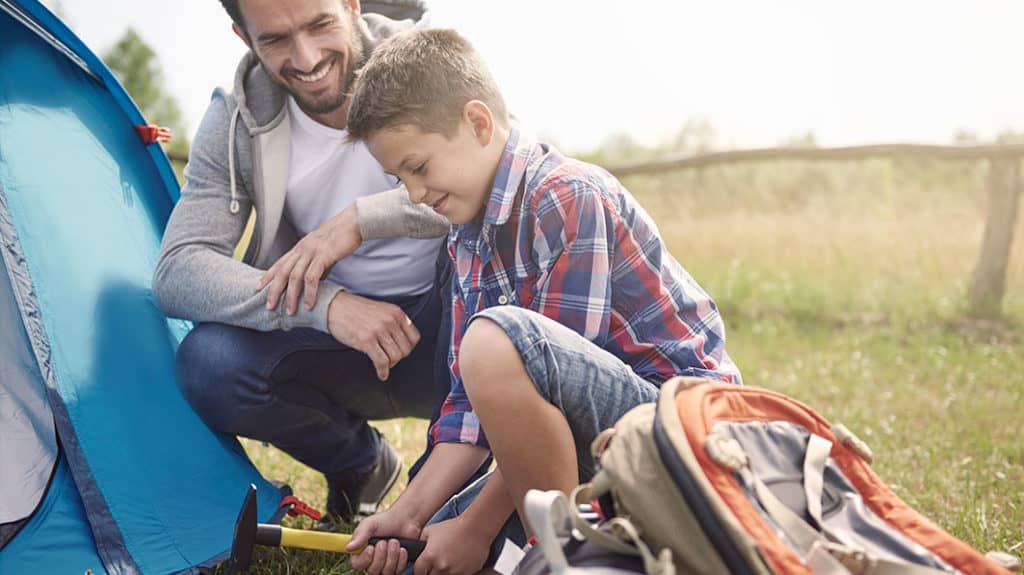 Father and son setting up a text together