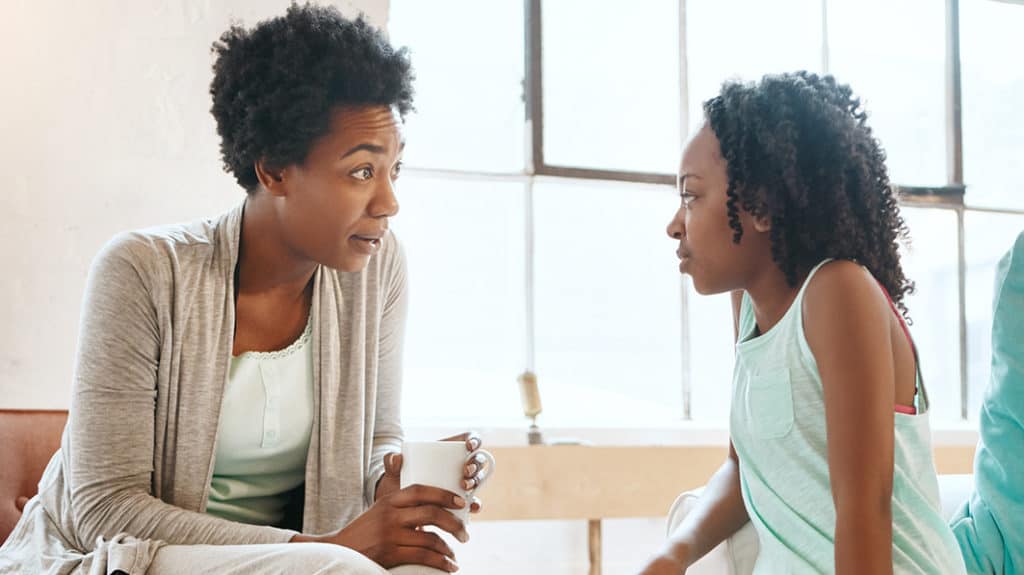 Mother talking to daughter