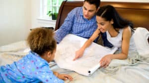 Family looking at blueprints