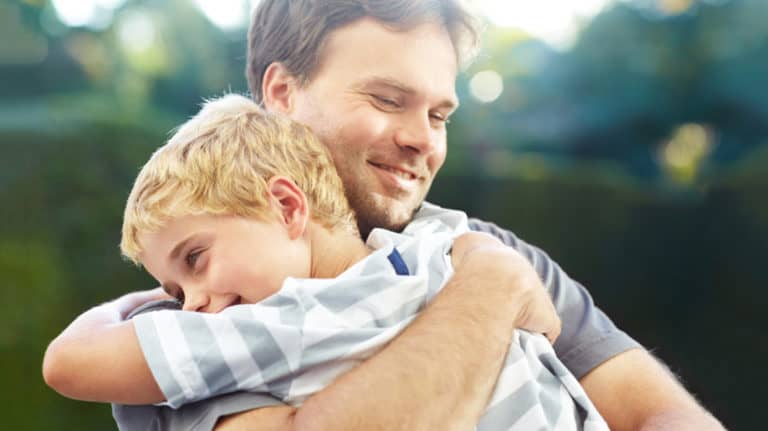 Father and son hugging