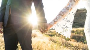 Newlyweds holding hands