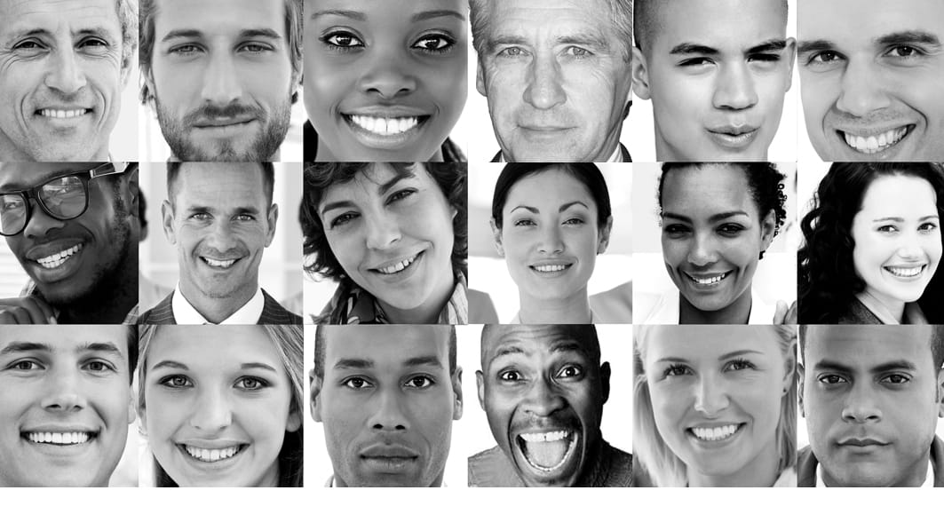 Black and white photo - a collage of close-ups of 18 people's faces, most smiling, a few serious-looking