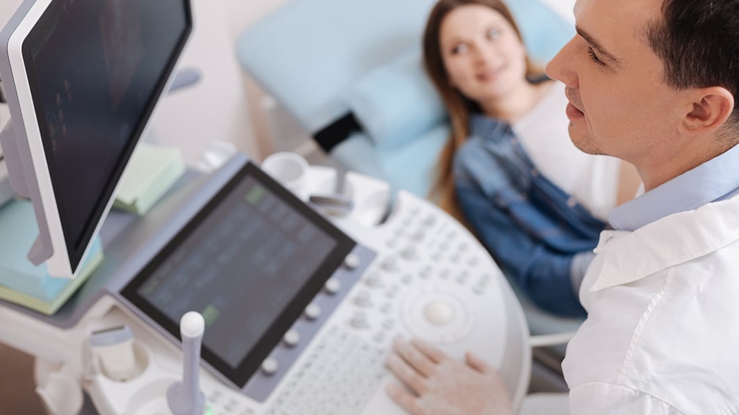 a photo of a doctor evaluating a women