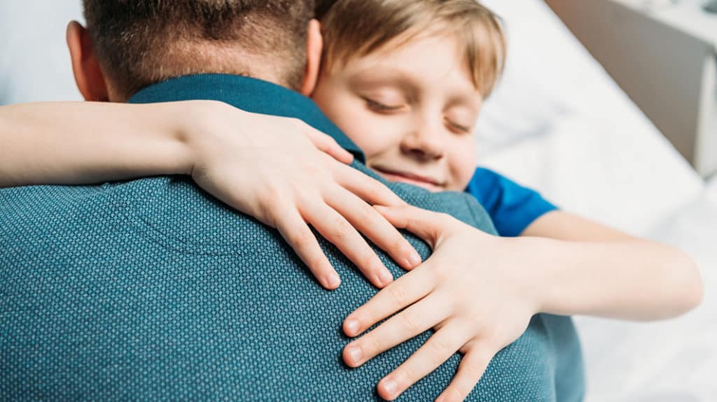 Son hugging his dad