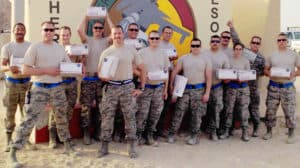 Honor and Support to our troops is seen as several service men and women are in the picture with packages that were sent to them.