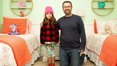 Over-enthusiastic dad with a big smile kneeling by his slightly-embarrassed young daughter in her bedroom