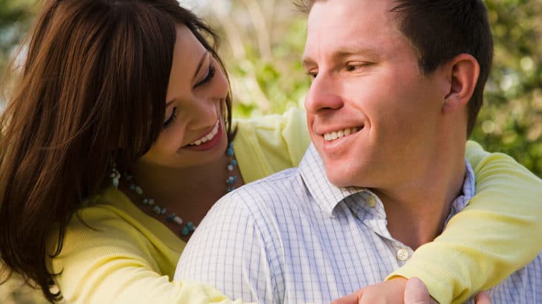 Husband and wife smiling at each other
