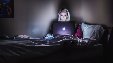 Pornography affects teens. Picture of girl sitting in front of glowing computer