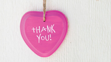 Close up of a pink heart with the phrase 