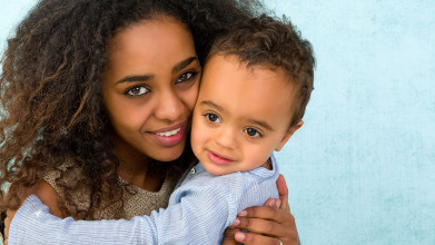 african american mother holding her child