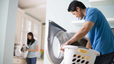husband and wife doing laundry