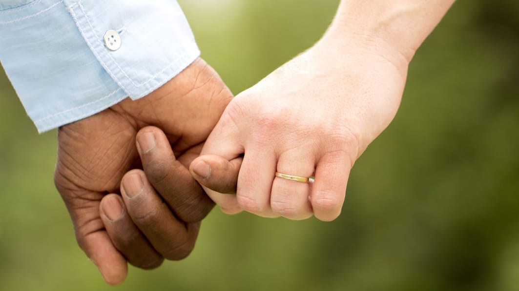 Married couple holding hand