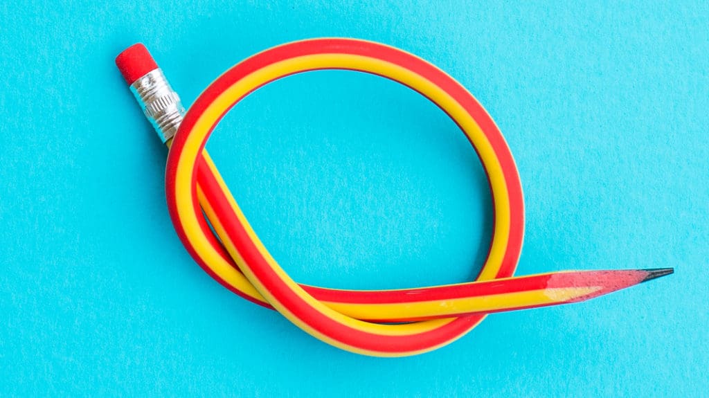 A flexible pencil is twisted into a knot.