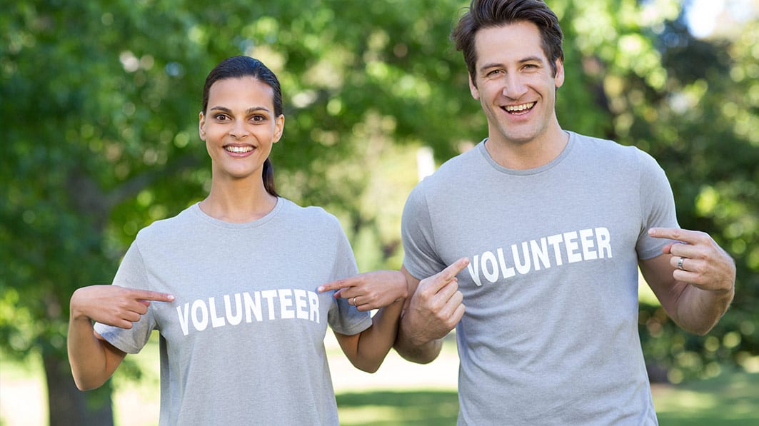 Married couple wearing volunteer t-shirts