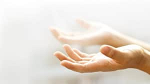 hands facing upward in prayer