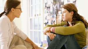 Mom talking with teen daughter