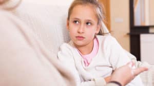 Young girl listening to her mom