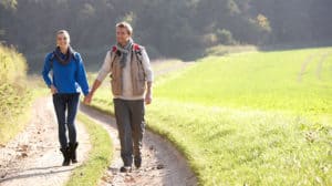 Young couple walking down path