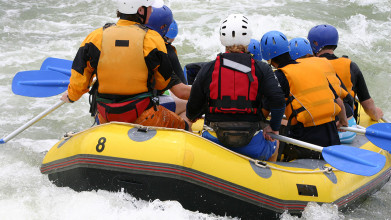 Group of people whitewater rafting