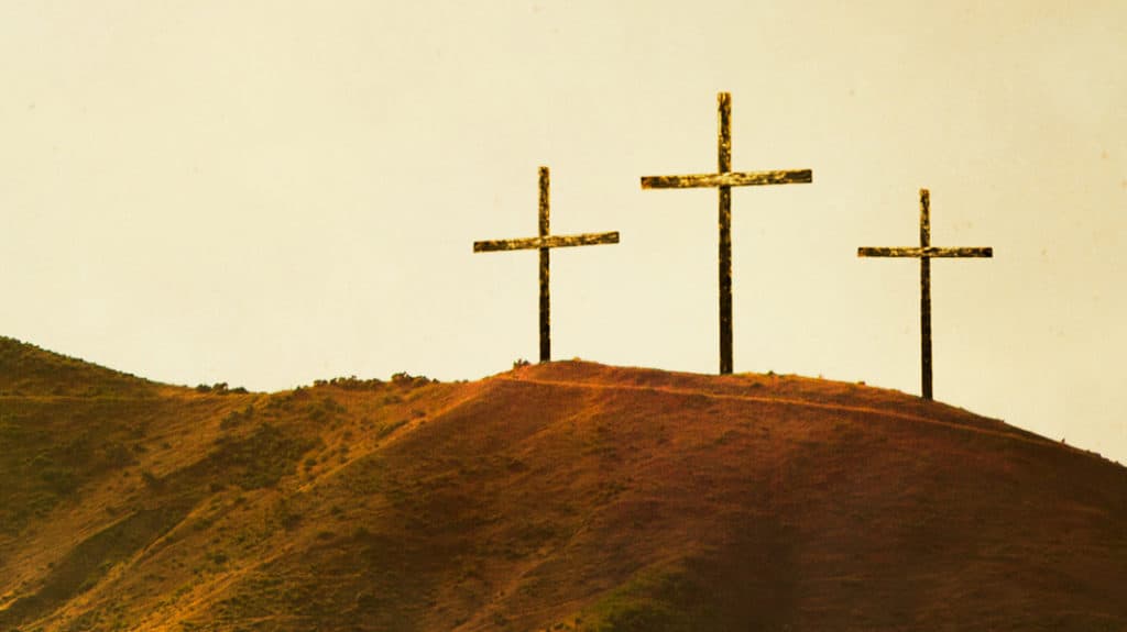 Three crosses on top of a hill