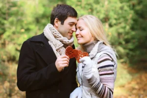 Husband and wife holding 2 hearts in their hands