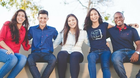 group of young adults sitting together