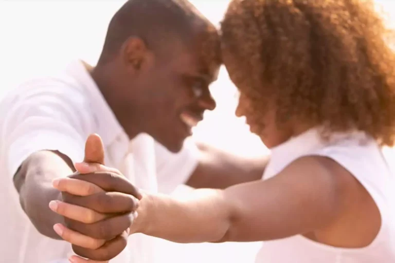 Husbands and wives were made to complement each other — a couple stands forehead to forehead, holding hands with love and unity.