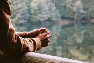 Man praying outside