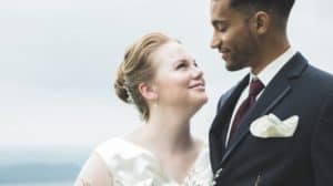 a man and a woman stand together during a wedding