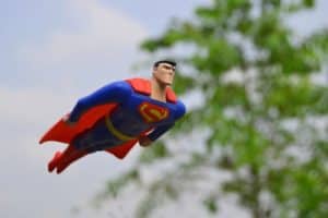 Superman flying is an image of a father. He is super to his family.