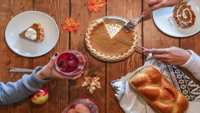 A family serves Thanksgiving dinner