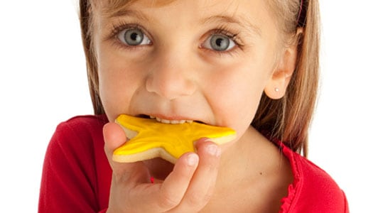 Child eating a Colorful Cookie